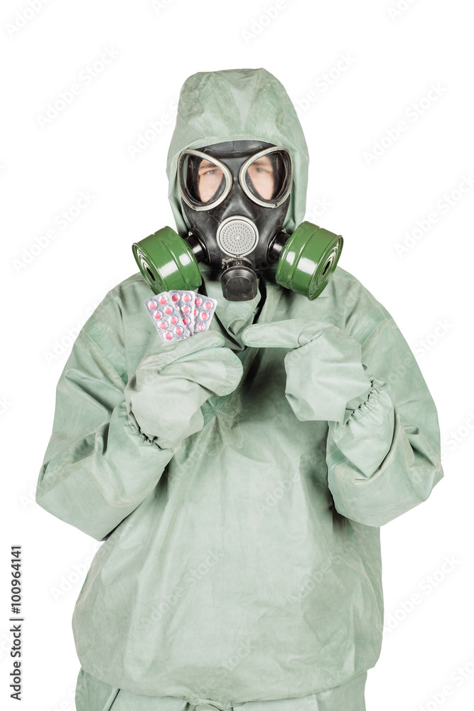 Man with protective mask and protective clothes holding out pill Man with protective mask and protective clothes holding out pill
