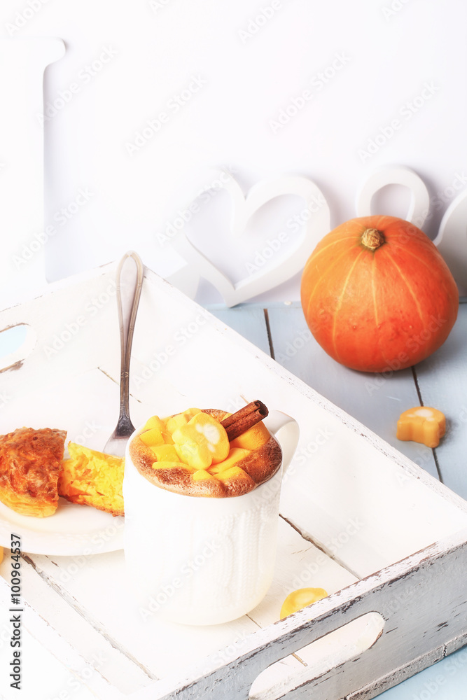 breakfast on a tray of coffee and pumpkin muffins selective soft focus rustic retro style