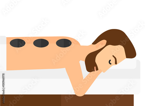 Man getting stone therapy.