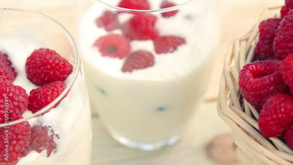 Raspberry in a glass of milk. Milk shake Raspberry in a glass of milk. Milk shake