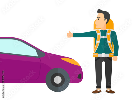 Young man hitchhiking.