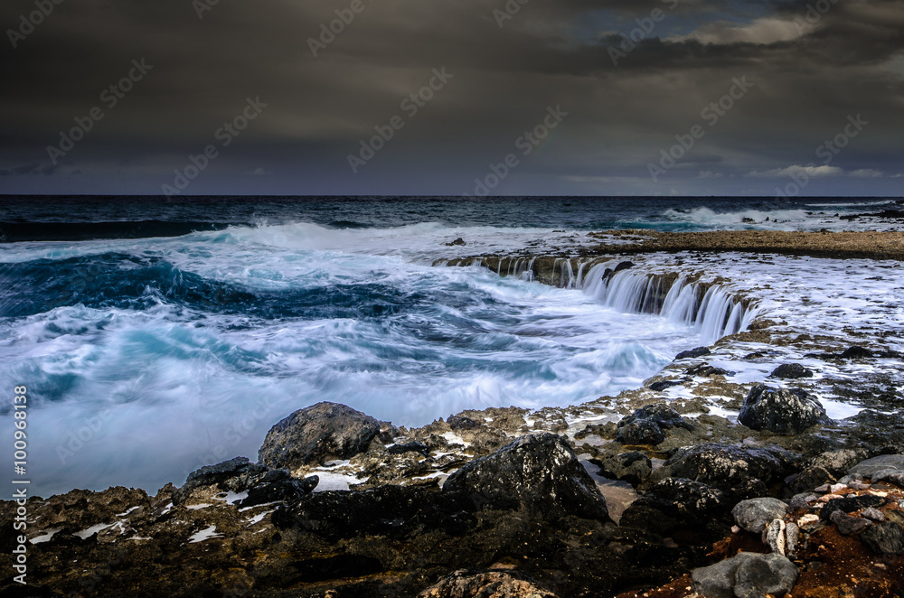 A windy day near the coast where the waves were creating small waterfalls. Crete-Greece. A windy day near the coast where the waves were creating small waterfalls. Crete-Greece.