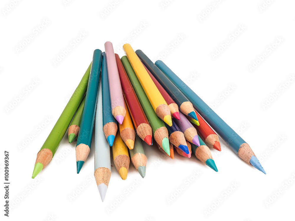 Photograph of a pile of colored pencils with their points toward the camera isolated on a white background. Photograph of a pile of colored pencils with their points toward the camera isolated on a white background.
