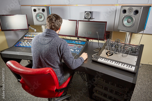 Audio engineer working in studio