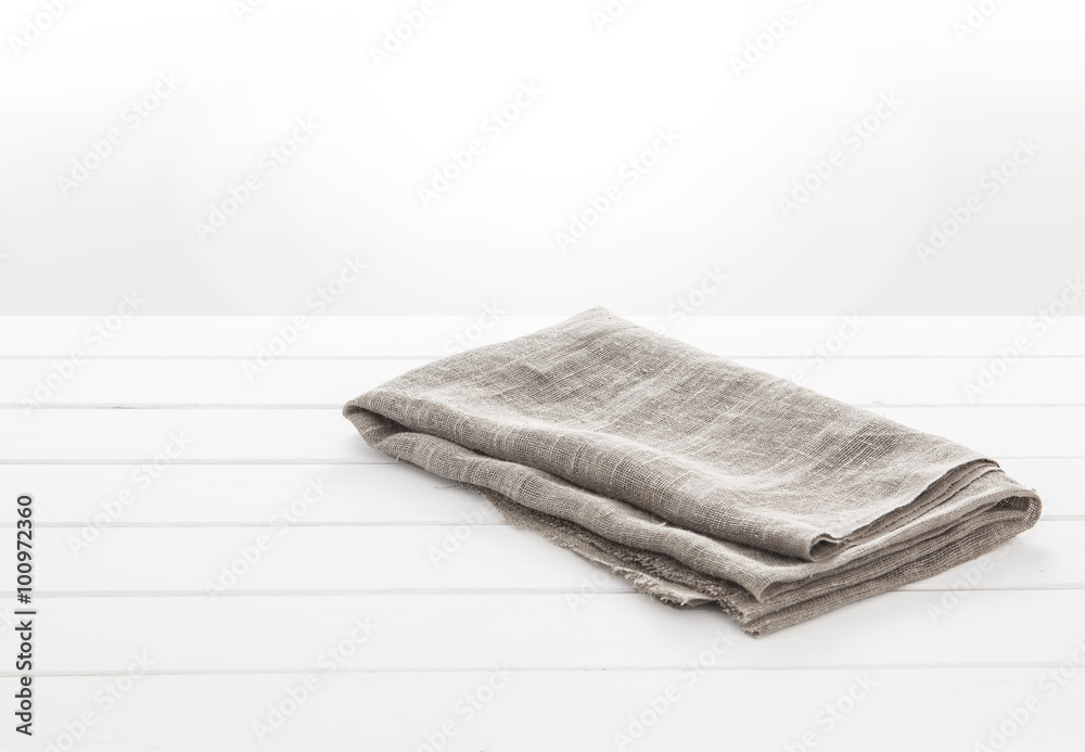 Kitchen towel on white wooden table Kitchen towel on white wooden table