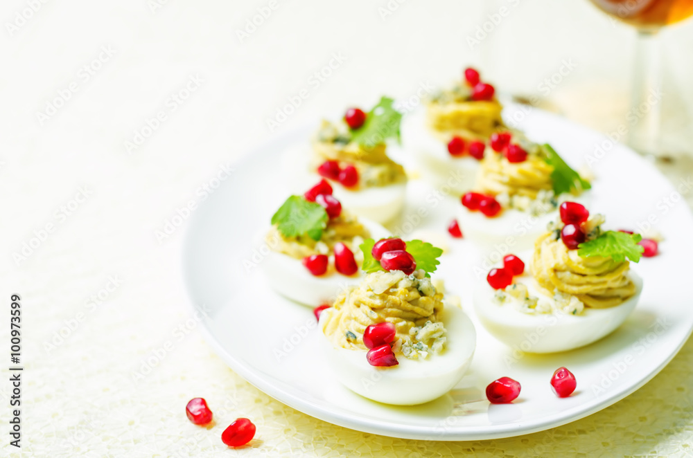 Blue cheese deviled eggs with pomegranate Blue cheese deviled eggs with pomegranate