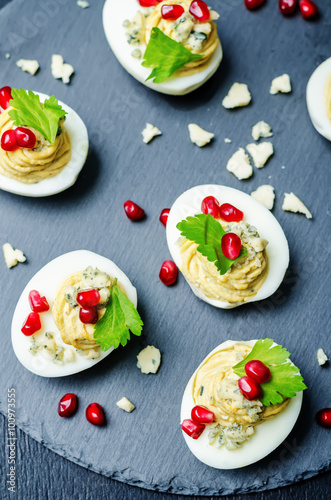 Blue cheese deviled eggs with pomegranate