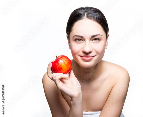 smiling girl holding apple in hand