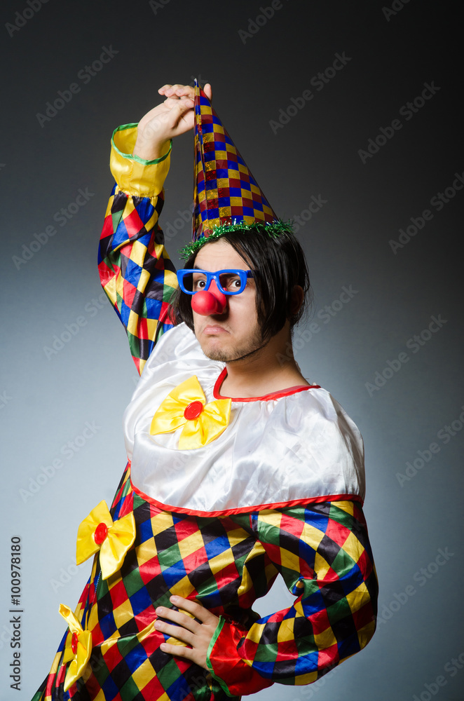 Funny clown against dark background Funny clown against dark background