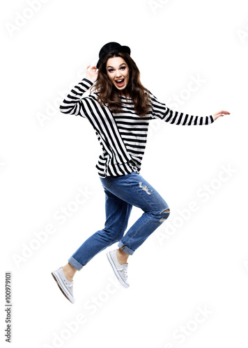 Beautiful jumping girl isolated on white 