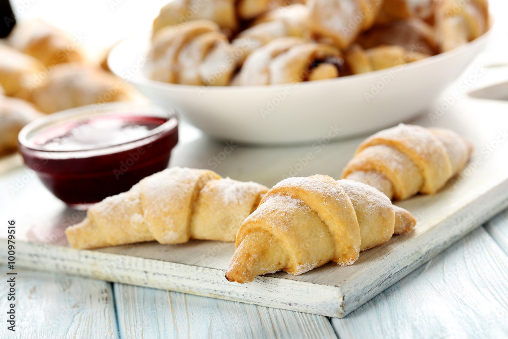 Fresh homemade croissants on a blue wooden table Fresh homemade croissants on a blue wooden table