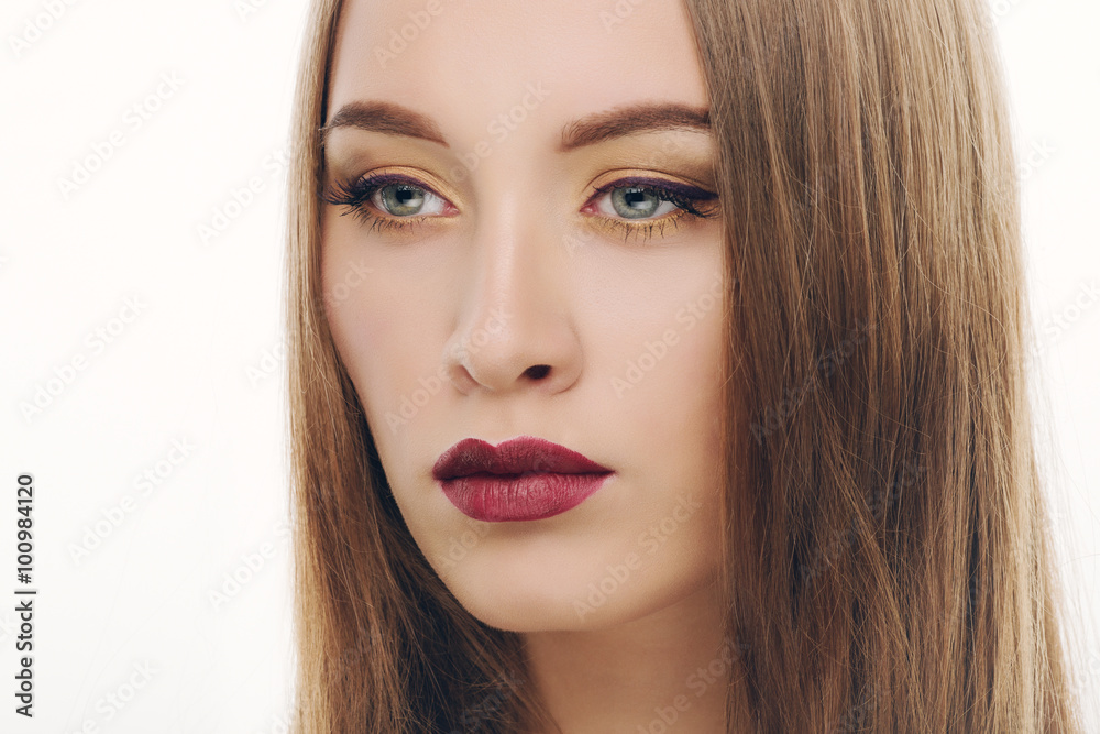 Closeup portrait of young fashionable woman with gorgeous makeup
