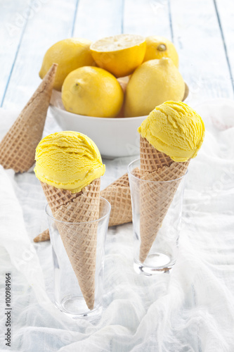 Lemon ice creams and cones.