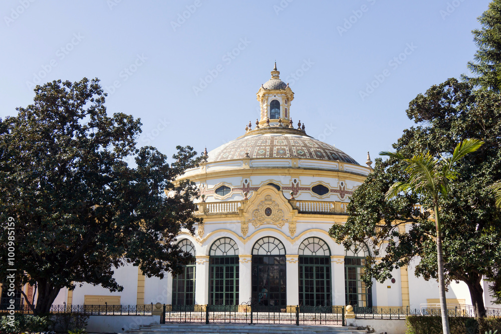 The beautiful building of Teatro Lope de Vega in the Parque de María Luisa with dome. It is a small Baroque-style theatre that was built for the Ibero-American Exposition of 1929 in Seville.