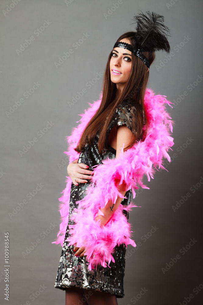 Girl pink plume and black feather on head. Carnival. Girl pink plume and black feather on head. Carnival.
