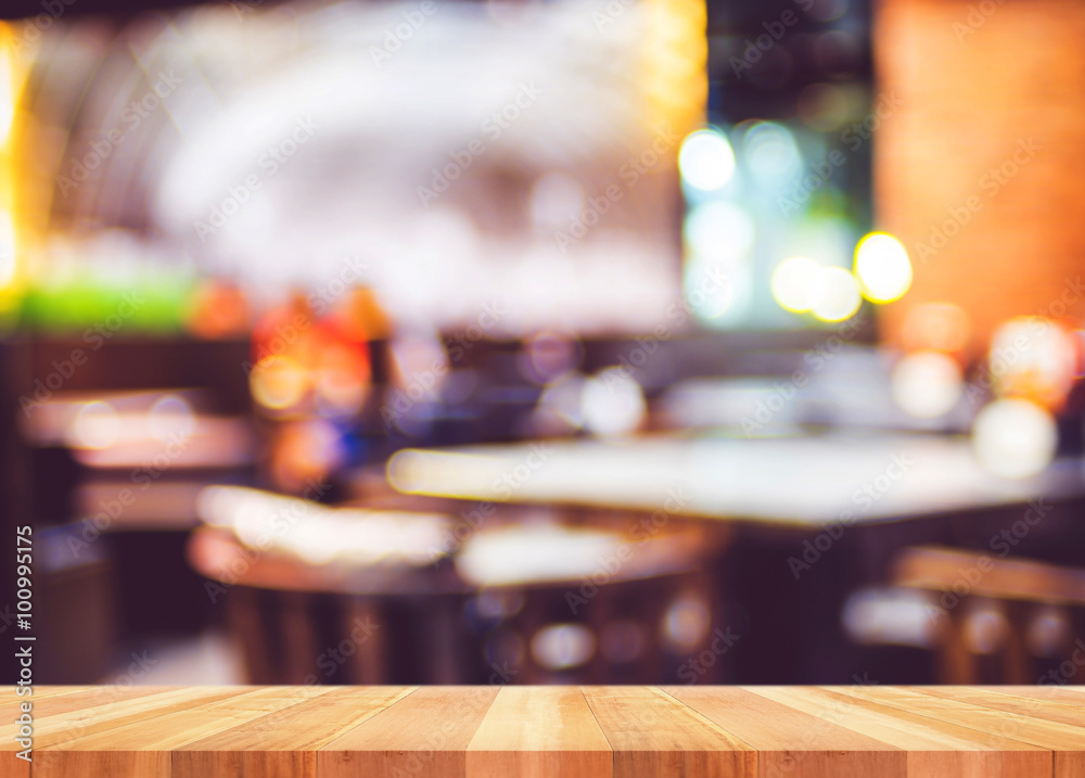 Empty wooden plank  table with blur restaurant background,Mock u