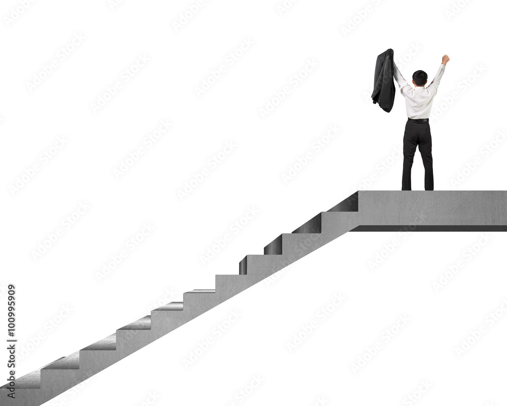 businessman cheering on top of concrete stairs isolated in white