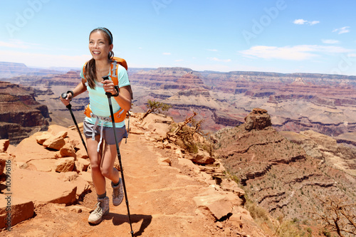 Slika na platnu Smiling young female hiker walking on Grand Canyon