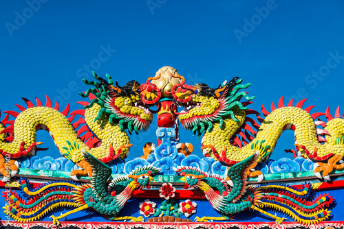 Chinese dragon on blue sky background. 
