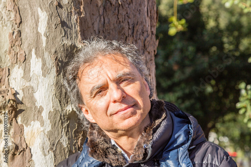 black down jacket man on a trunk