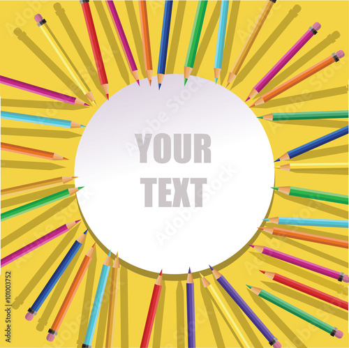 Color pencils with round frame on yellow background