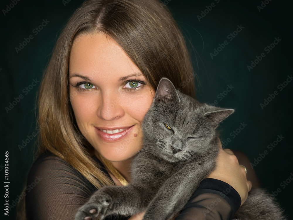 Indoor photo with a ring light from a beautiful young woman with her domestic cat