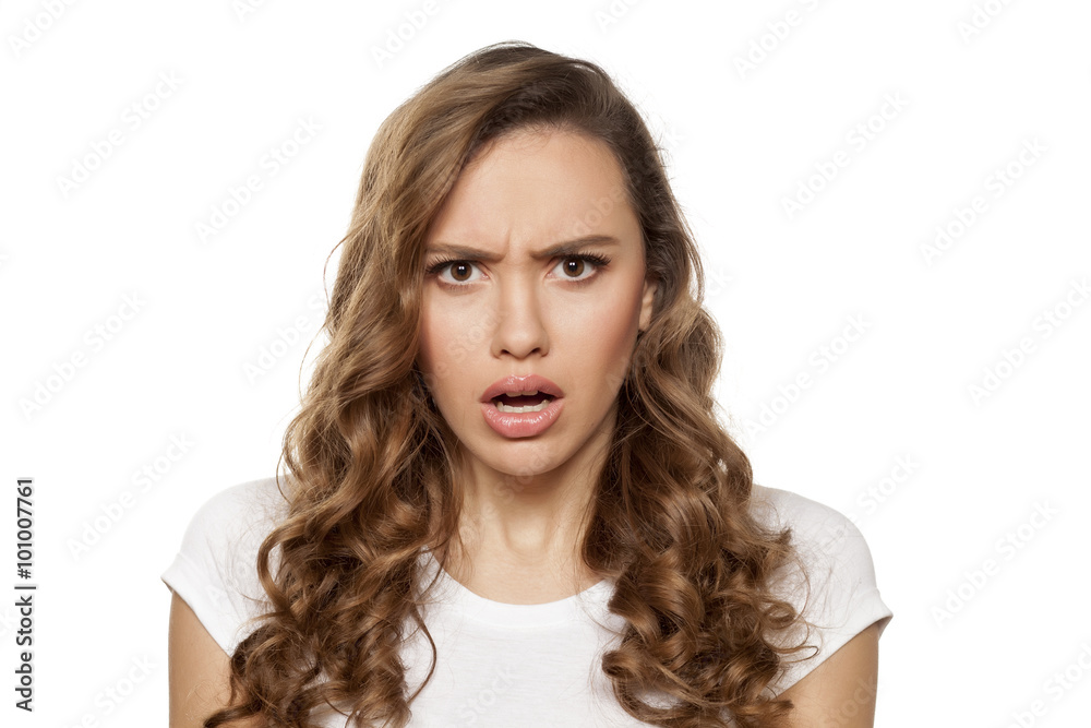scowling pretty girl with questionable gesture on a white
scowling pretty girl with questionable gesture on a white