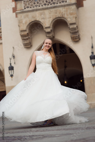Twisting and turning. Full length soft focus shot of a happy bride twirling in her dress laughing