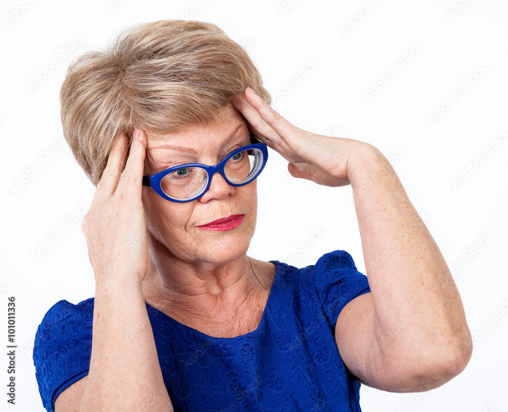 Mature Caucasian woman with migraine, holding her head with hands, white background Mature Caucasian woman with migraine, holding her head with hands, white background