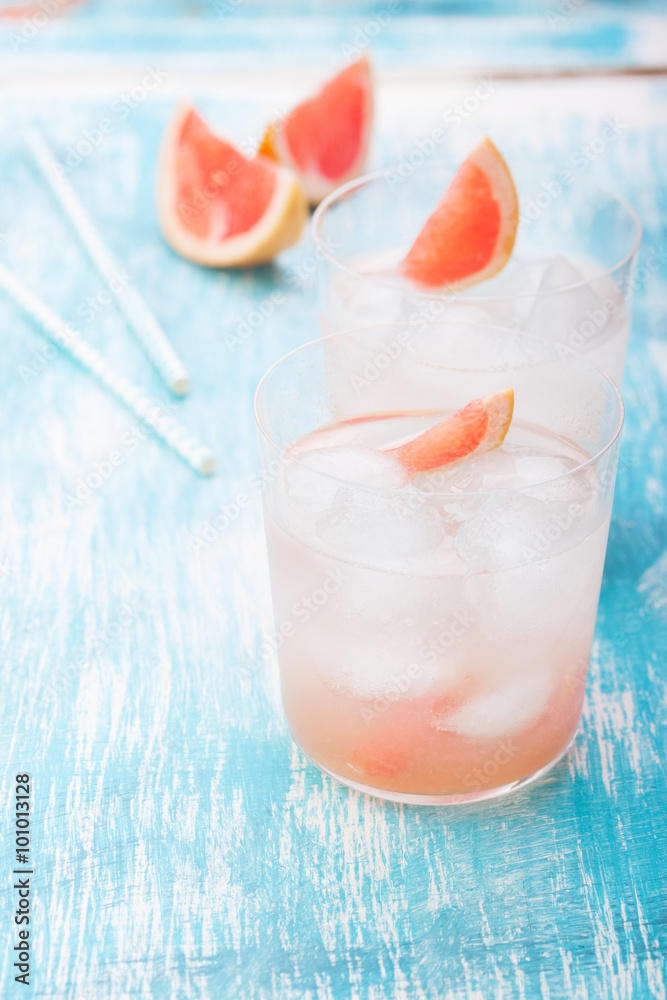 Juicy grapefruit cocktail with ice and alcohol, selective focus. Juicy grapefruit cocktail with ice and alcohol, selective focus.