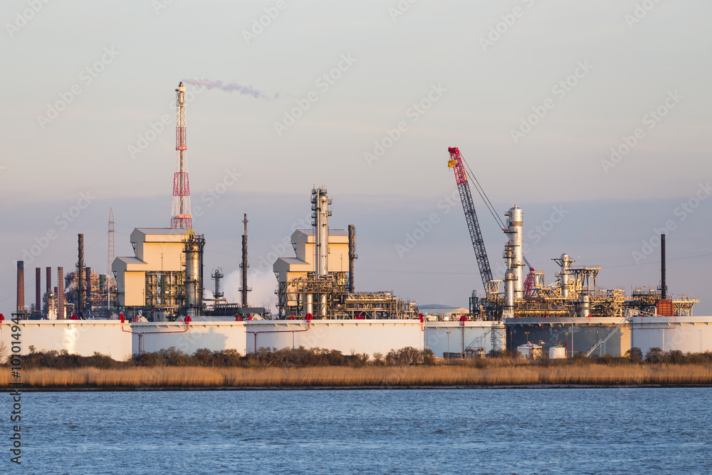 Port Refinery Oil Tanks In Evening Sunlight