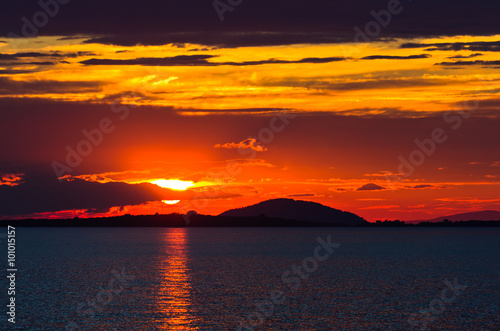 Sunset at sea, with small greek islands in background, Sithonia, Greece © banepetkovic