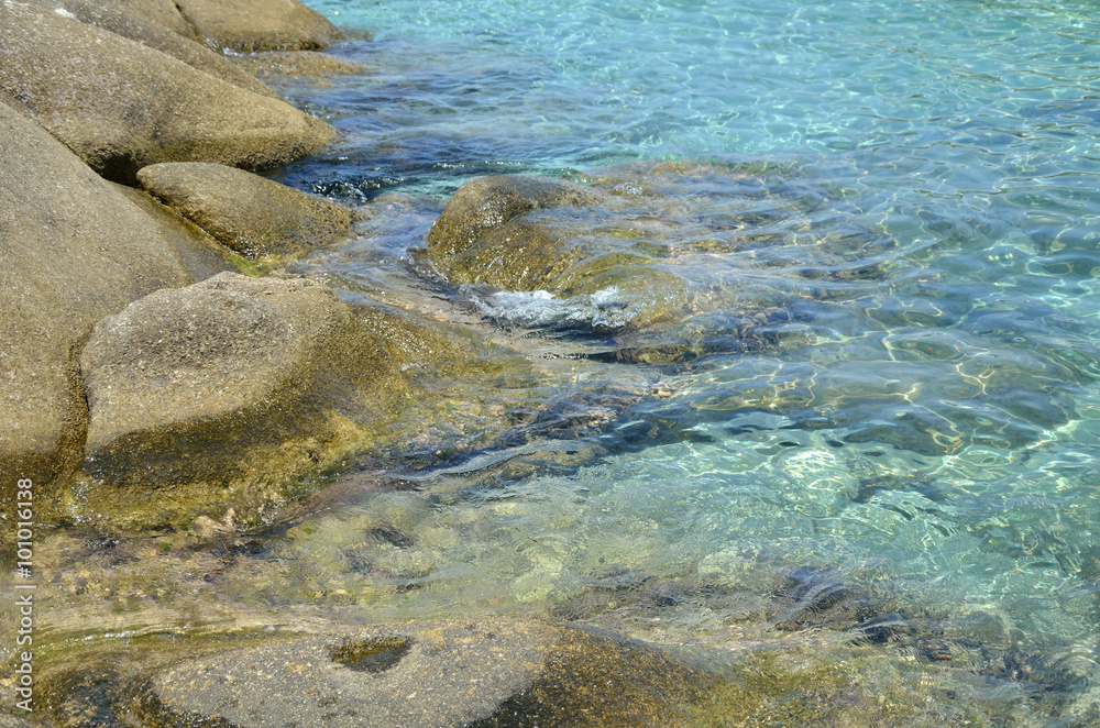 Turquoise Sea Water and Stones