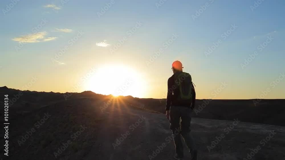 Young girl walking through the Canyons at sunset Young girl walking through the Canyons at sunset