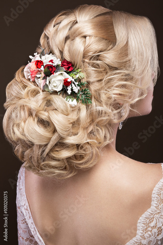 beautiful blond girl in image of the bride with purple flowers on her head. Beauty face. Hairstyle back view