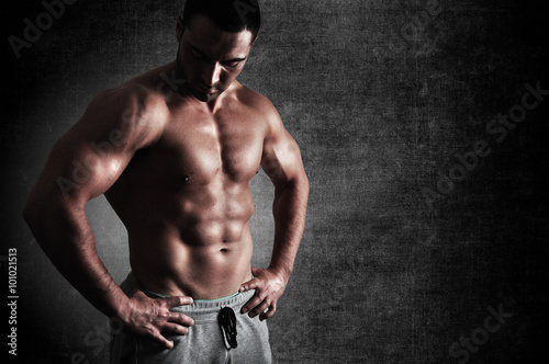 Portrait of a strong athletic young man without a shirt.
