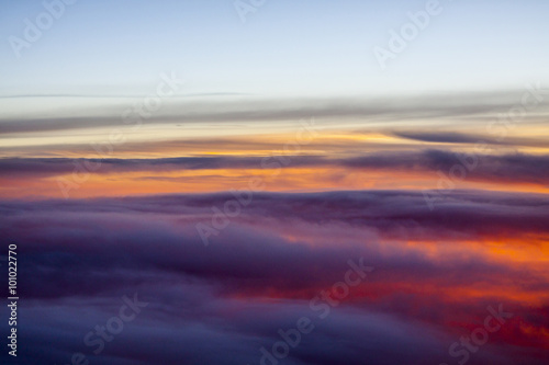 Flight Above the Cloud Layer during Vibrant Sunset