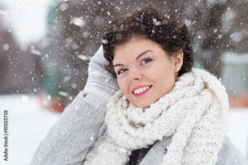 Young pretty woman portrait outdoors in winter