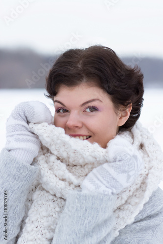 Young pretty woman portrait outdoors in winter