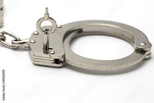 Close-up of key in handcuffs