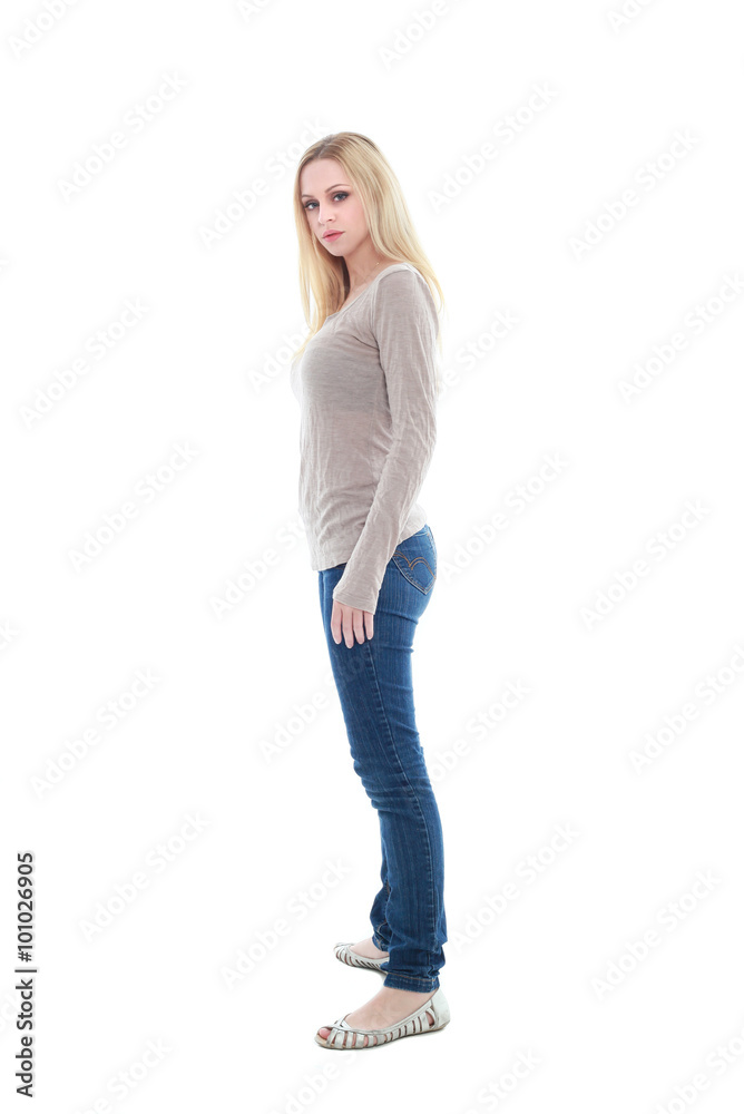 beautiful young woman with long blonde hair wearing a long sleeved cream shirt and gold necklace. standing pose, isolated on white background. beautiful young woman with long blonde hair wearing a long sleeved cream shirt and gold necklace. standing pose, isolated on white background.
