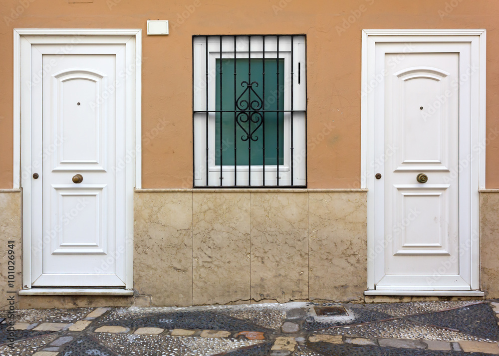 House Facade with Two White Doors