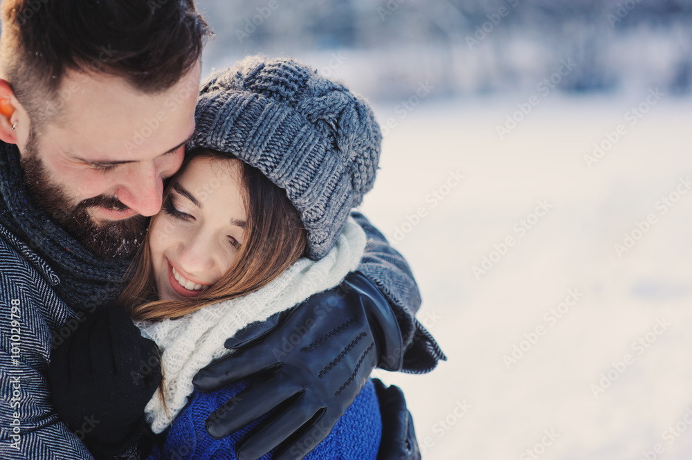 happy loving couple walking in snowy winter forest, spending christmas vacation together. Outdoor seasonal activities. Lifestyle capture. happy loving couple walking in snowy winter forest, spending christmas vacation together. Outdoor seasonal activities. Lifestyle capture.