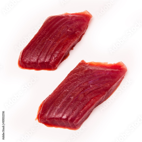 Raw Yellowfin tuna fish steaks isolated on a white background