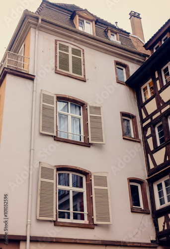 Facade of an ancient building with large Windows of the European city