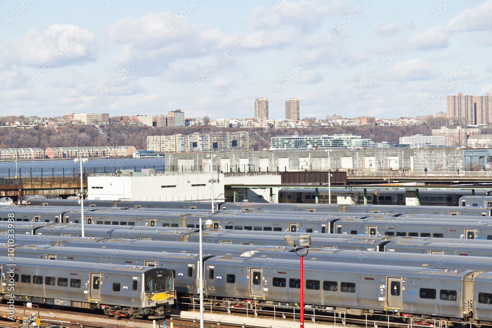 Subway trains and Manhattan apartment buildings