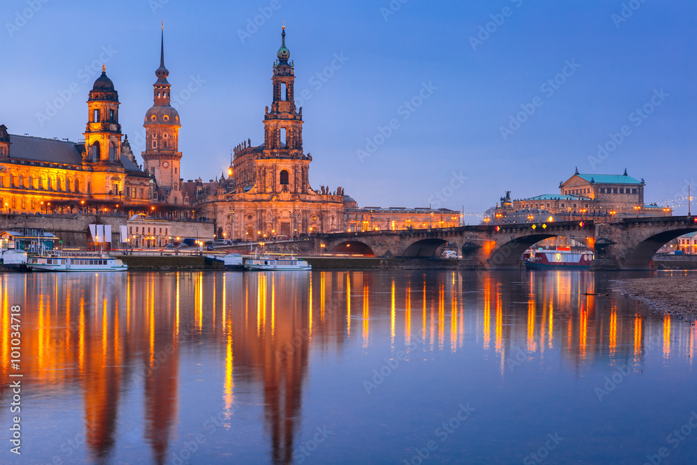 Dresden Cathedral of the Holy Trinity or Hofkirche, Bruehl's Terrace or The Balcony of Europe, Semperoper and Augustus Bridge with reflections in the river Elbe at night in Dresden, Saxony, Germany