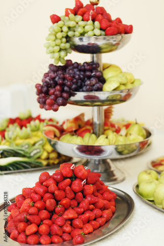 Tasty and delicious healthy fruit table grapes, apples and red s