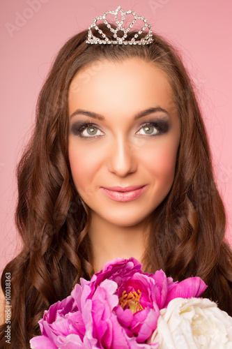 wedding makeup. Portrait of a bride on a pink background