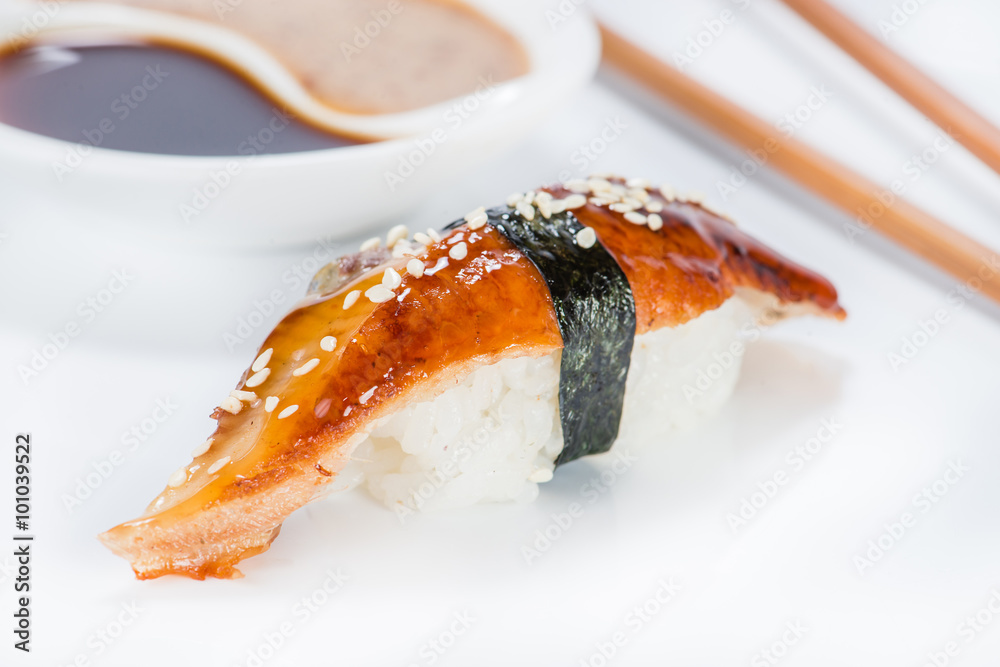 Image of nigiri sushi over white background with chopsticks and Image of nigiri sushi over white background with chopsticks and